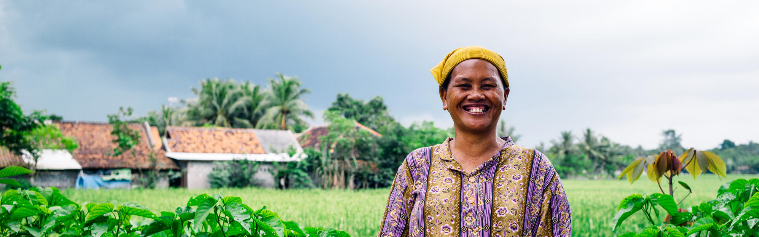 Woman standing in front of a field